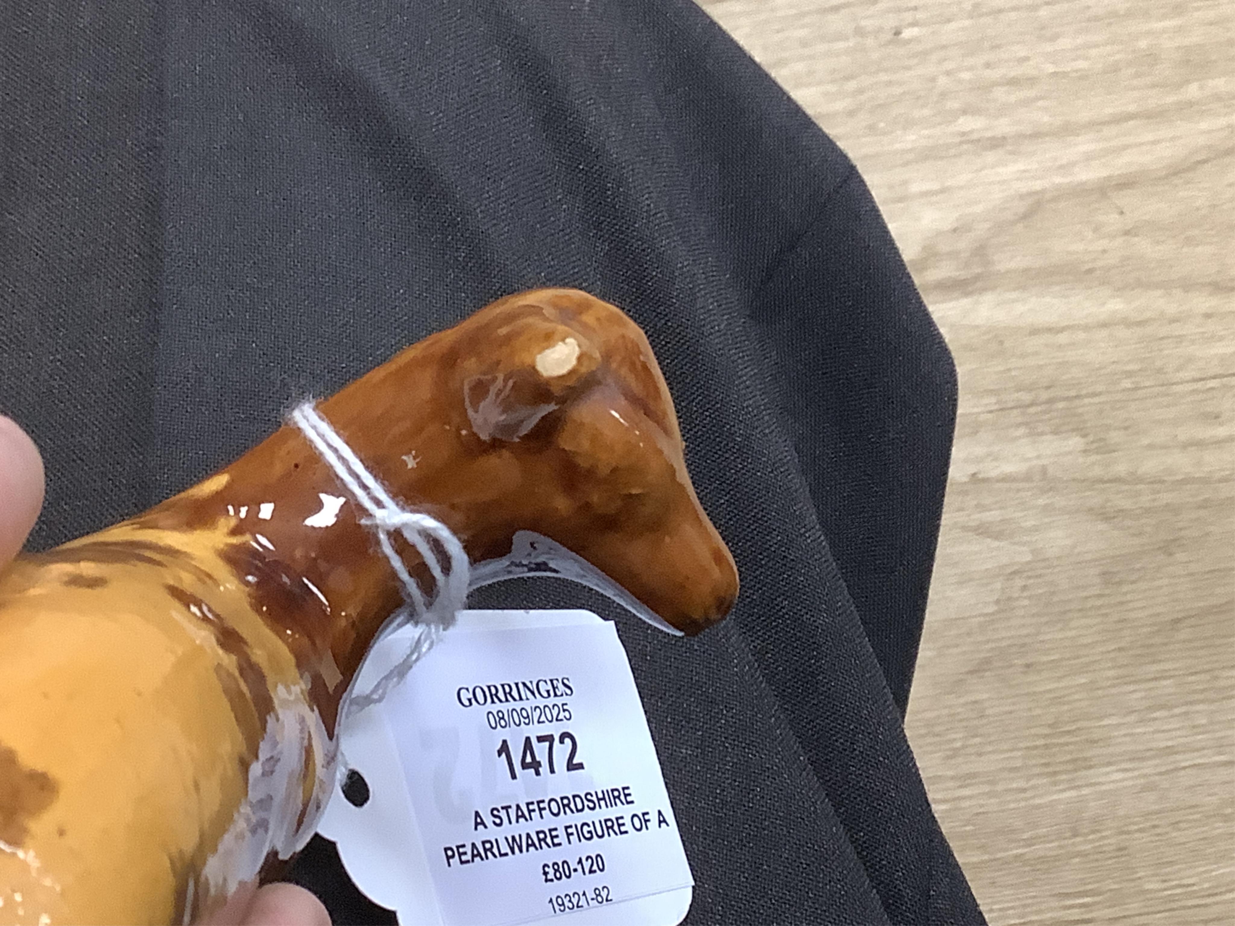 A Staffordshire Pearlware figure of a recumbent ewe, a Staffordshire glazed terracotta figure of a recumbent deer and a Staffordshire pearlware model of a badger?, largest 14cm wide